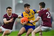 19 January 2024; Cathal Heneghan of Roscommon in action against Antaine Ó Laoi, left, and Liam Boyle of Galway during the Connacht FBD League final match between Roscommon and Galway at University of Galway Connacht GAA AirDome in Bekan, Mayo. Photo by Tyler Miller/Sportsfile