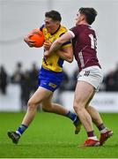 19 January 2024; Dylan Ruane of Roscommon in action against Diarmuid Kilcommins of Galway during the Connacht FBD League final match between Roscommon and Galway at University of Galway Connacht GAA AirDome in Bekan, Mayo. Photo by Tyler Miller/Sportsfile