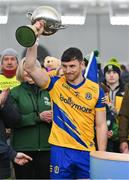 19 January 2024; Diarmuid Murtagh of Roscommon lifts the cup after his side's victory in the Connacht FBD League final match between Roscommon and Galway at University of Galway Connacht GAA AirDome in Bekan, Mayo. Photo by Tyler Miller/Sportsfile