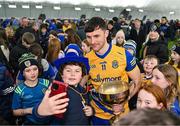 19 January 2024; Diarmuid Murtagh of Roscommon celebrates with the cup and supporters after his side's victory in the Connacht FBD League final match between Roscommon and Galway at University of Galway Connacht GAA AirDome in Bekan, Mayo. Photo by Tyler Miller/Sportsfile