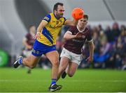 19 January 2024; Donie Smith of Roscommon in action against Jack Kirrane of Galway during the Connacht FBD League final match between Roscommon and Galway at University of Galway Connacht GAA AirDome in Bekan, Mayo. Photo by Tyler Miller/Sportsfile