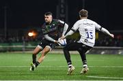 19 January 2024; Tiernan O’Halloran of Connacht in action against Max Malins of Bristol Bears during the Investec Champions Cup Pool 1 Round 4 match between Connacht and Bristol Bears at the Dexcom Stadium in Galway. Photo by Seb Daly/Sportsfile