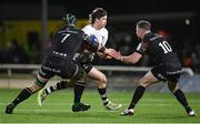 19 January 2024; Benhard Janse van Rensburg of Bristol Bears is tackled by Shamus Hurley-Langton, left, and JJ Hanrahan of Connacht during the Investec Champions Cup Pool 1 Round 4 match between Connacht and Bristol Bears at the Dexcom Stadium in Galway. Photo by Seb Daly/Sportsfile