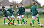 20 January 2024; Aiden Gabbidon of Republic of Ireland, centre, and teammates warm-up before the international friendly match between Republic of Ireland MU15 and Australia U16 Schoolboys at the FAI National Training Centre in Abbotstown, Dublin. Photo by Seb Daly/Sportsfile