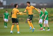 20 January 2024; Munib Smajic of Australia, left, celebrates with teammate Nicholas Badolato after scoring their side's first goal during the international friendly match between Republic of Ireland MU15 and Australia U16 Schoolboys at the FAI National Training Centre in Abbotstown, Dublin. Photo by Seb Daly/Sportsfile