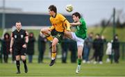 20 January 2024; Will Dobson of Australia in action against Jason Spelman of Republic of Ireland during the international friendly match between Republic of Ireland MU15 and Australia U16 Schoolboys at the FAI National Training Centre in Abbotstown, Dublin. Photo by Seb Daly/Sportsfile
