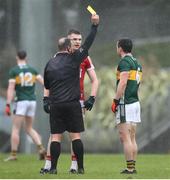 20 January 2024; Referee Donnacha O’Callaghan issues a yellow card to both Paul Murphy of Kerry and David Buckley of Cork during the McGrath Cup final match between Kerry and Cork at Páirc Ui Rinn in Cork. Photo by Michael P Ryan/Sportsfile