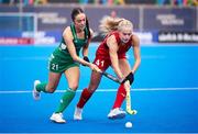 20 January 2024; Lily Walker of Great Britain in action against Katie McKee of Ireland during the FIH Women's Olympic Hockey Qualifying Tournament third/fourth place play-off match between Ireland and Great Britain at Campo de Hockey Hierba Tarongers in Valencia, Spain. Photo by Manuel Queimadelos/Sportsfile