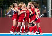 20 January 2024; Sarah Jones of Great Britain celebrates with teammates after scoring her side's first goal during the FIH Women's Olympic Hockey Qualifying Tournament third/fourth place play-off match between Ireland and Great Britain at Campo de Hockey Hierba Tarongers in Valencia, Spain. Photo by Manuel Queimadelos/Sportsfile