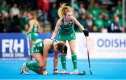20 January 2024; Deirdre Duke of Ireland lies injured on the field as teammate Niamh Carey calls for attention during the FIH Women's Olympic Hockey Qualifying Tournament third/fourth place play-off match between Ireland and Great Britain at Campo de Hockey Hierba Tarongers in Valencia, Spain. Photo by Manuel Queimadelos/Sportsfile
