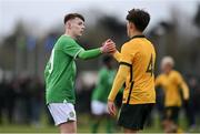 20 January 2024; Finn Duffy of Republic of Ireland and Lachlan McDonald of Australia shake hands after the international friendly match between Republic of Ireland MU15 and Australia U16 Schoolboys at the FAI National Training Centre in Abbotstown, Dublin. Photo by Seb Daly/Sportsfile