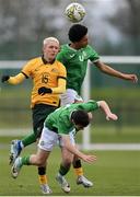 20 January 2024; Forbes Porter of Australia in action against Republic of Ireland players Aiden Gabbidon, behind, Jason Spelman during the international friendly match between Republic of Ireland MU15 and Australia U16 Schoolboys at the FAI National Training Centre in Abbotstown, Dublin. Photo by Seb Daly/Sportsfile