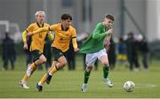 20 January 2024; Finn Duffy of Republic of Ireland is pulled back by Lachlan McDonald of Australia during the international friendly match between Republic of Ireland MU15 and Australia U16 Schoolboys at the FAI National Training Centre in Abbotstown, Dublin. Photo by Seb Daly/Sportsfile