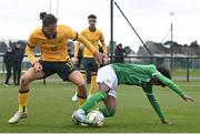 20 January 2024; David Dunne of Republic of Ireland in action against Lachlan Henderson of Australia during the international friendly match between Republic of Ireland MU15 and Australia U16 Schoolboys at the FAI National Training Centre in Abbotstown, Dublin. Photo by Seb Daly/Sportsfile