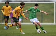 20 January 2024; Jason Spelman of Republic of Ireland in action against Lachlan Henderson of Australia during the international friendly match between Republic of Ireland MU15 and Australia U16 Schoolboys at the FAI National Training Centre in Abbotstown, Dublin. Photo by Seb Daly/Sportsfile