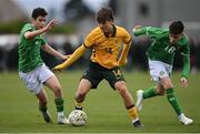 20 January 2024; Will Dobson of Australia in action against Republic of Ireland's Jason Spelman , left, and Brody Collins during the international friendly match between Republic of Ireland MU15 and Australia U16 Schoolboys at the FAI National Training Centre in Abbotstown, Dublin. Photo by Seb Daly/Sportsfile