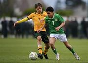 20 January 2024; Victor Ozhianvuna of Republic of Ireland in action against Oliver Sacks of Australia during the international friendly match between Republic of Ireland MU15 and Australia U16 Schoolboys at the FAI National Training Centre in Abbotstown, Dublin. Photo by Seb Daly/Sportsfile