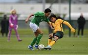 20 January 2024; Aiden Gabbidon of Republic of Ireland in action against Dallo Sandy of Australia during the international friendly match between Republic of Ireland MU15 and Australia U16 Schoolboys at the FAI National Training Centre in Abbotstown, Dublin. Photo by Seb Daly/Sportsfile