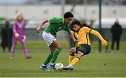 20 January 2024; Aidan Gabbidon of Republic of Ireland in action against Dallo Sandy of Australia during the international friendly match between Republic of Ireland MU15 and Australia U16 Schoolboys at the FAI National Training Centre in Abbotstown, Dublin. Photo by Seb Daly/Sportsfile