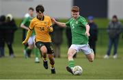 20 January 2024; Séan Spaight of Republic of Ireland in action against Will Dobson of Australia during the international friendly match between Republic of Ireland MU15 and Australia U16 Schoolboys at the FAI National Training Centre in Abbotstown, Dublin. Photo by Seb Daly/Sportsfile