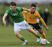 20 January 2024; Richard Ferizaj of Republic of Ireland in action against Munib Smajic of Australia during the international friendly match between Republic of Ireland MU15 and Australia U16 Schoolboys at the FAI National Training Centre in Abbotstown, Dublin. Photo by Seb Daly/Sportsfile