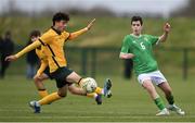 20 January 2024; Jason Spelman of Republic of Ireland and Nicholas Badolato of Australia during the international friendly match between Republic of Ireland MU15 and Australia U16 Schoolboys at the FAI National Training Centre in Abbotstown, Dublin. Photo by Seb Daly/Sportsfile