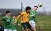 20 January 2024; Séan Spaight of Republic of Ireland and Dallo Sandy of Australia during the international friendly match between Republic of Ireland MU15 and Australia U16 Schoolboys at the FAI National Training Centre in Abbotstown, Dublin. Photo by Seb Daly/Sportsfile