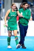20 January 2024; Katie Mullan of Ireland is consoled by head coach Sean Dancer after their side's defeat in the FIH Women's Olympic Hockey Qualifying Tournament third/fourth place play-off match between Ireland and Great Britain at Campo de Hockey Hierba Tarongers in Valencia, Spain. Photo by Manuel Queimadelos/Sportsfile
