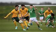 20 January 2024; Richard Ferizaj of Republic of Ireland in action against Munib Smajic of Australia during the international friendly match between Republic of Ireland MU15 and Australia U16 Schoolboys at the FAI National Training Centre in Abbotstown, Dublin. Photo by Seb Daly/Sportsfile