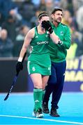 20 January 2024; Roisin Upton of Ireland is consoled by head coach Sean Dancer after their side's defeat in the FIH Women's Olympic Hockey Qualifying Tournament third/fourth place play-off match between Ireland and Great Britain at Campo de Hockey Hierba Tarongers in Valencia, Spain. Photo by Manuel Queimadelos/Sportsfile