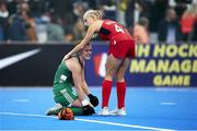 20 January 2024; Roisin Upton of Ireland is consoled by Lily Walker of Great Britain after the FIH Women's Olympic Hockey Qualifying Tournament third/fourth place play-off match between Ireland and Great Britain at Campo de Hockey Hierba Tarongers in Valencia, Spain. Photo by Manuel Queimadelos/Sportsfile
