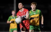 20 January 2024; Conor McCluskey of Derry in action against Ciarán Moore of Donegal during the Bank of Ireland Dr McKenna Cup final match between Derry and Donegal at O'Neills Healy Park in Omagh, Tyrone. Photo by Ramsey Cardy/Sportsfile
