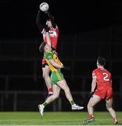 20 January 2024; Brendan Rogers of Derry and Odhran Doherty of Donegal during the Bank of Ireland Dr McKenna Cup final match between Derry and Donegal at O'Neills Healy Park in Omagh, Tyrone. Photo by Ramsey Cardy/Sportsfile