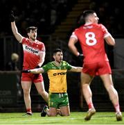 20 January 2024; Padraig McGrogan of Derry calls for a point, as Ryan McHugh of Donegal calls for a wide during the Bank of Ireland Dr McKenna Cup final match between Derry and Donegal at O'Neills Healy Park in Omagh, Tyrone. Photo by Ramsey Cardy/Sportsfile