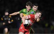 20 January 2024; Cormac Murphy of Derry in action against Domhnall Mac Giolla Bhride of Donegal during the Bank of Ireland Dr McKenna Cup final match between Derry and Donegal at O'Neills Healy Park in Omagh, Tyrone. Photo by Ramsey Cardy/Sportsfile