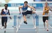 20 January 2024; Adam Nolan of St L O'Toole AC, Carlow, centre, competes in the  U23 Men's 60m Hurdles heats during the 123.ie National Indoor U20 & U23s Athletics Championships at the TUS International Arena in Athlone, Westmeath. Photo by Tyler Miller/Sportsfile