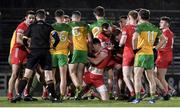 20 January 2024; Players from both teams tussle during the Bank of Ireland Dr McKenna Cup final match between Derry and Donegal at O'Neills Healy Park in Omagh, Tyrone. Photo by Ramsey Cardy/Sportsfile