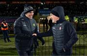 20 January 2024; Derry manager Mickey Harte, right, and Donegal manager Jim McGuinness shake hands after the Bank of Ireland Dr McKenna Cup final match between Derry and Donegal at O'Neills Healy Park in Omagh, Tyrone. Photo by Ramsey Cardy/Sportsfile