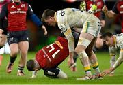 20 January 2024; Calvin Nash of Munster is tackled by George Furbank of Northampton Saints, resulting in a yellow card for George Furbank, during the Investec Champions Cup Pool 3 Round 4 match between Munster and Northampton Saints at Thomond Park in Limerick. Photo by Brendan Moran/Sportsfile