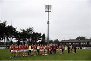 20 January 2024; Cork players stand for the playing of the national anthem before the McGrath Cup final match between Kerry and Cork at Páirc Ui Rinn in Cork. Photo by Michael P Ryan/Sportsfile