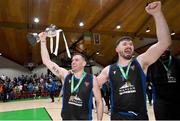 20 January 2024; UCC Demons captain Kyle Hosford, left, and teammates David Lehane celebrate with the trophy after their side's victory in the Basketball Ireland Pat Duffy National Cup Final match between Irish Guide Dogs Ballincollig and UCC Demons at the National Basketball Arena in Tallaght, Dublin. Photo by Seb Daly/Sportsfile