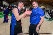 20 January 2024; UCC Demons coach Daniel O'Mahony, right, and captain Kyle Hosford celebrate after the Basketball Ireland Pat Duffy National Cup Final match between Irish Guide Dogs Ballincollig and UCC Demons at the National Basketball Arena in Tallaght, Dublin. Photo by Seb Daly/Sportsfile