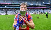 21 January 2024; Fintan Burke of St Thomas' kisses the Tommy Moore Cup after his side's victory in the AIB GAA Hurling All-Ireland Senior Club Championship Final match between O’Loughlin Gaels of Kilkenny and St Thomas’ of Galway at Croke Park in Dublin. Photo by Piaras Ó Mídheach/Sportsfile