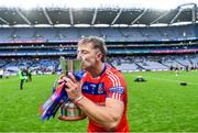 21 January 2024; Fintan Burke of St Thomas' kisses the Tommy Moore Cup after his side's victory in the AIB GAA Hurling All-Ireland Senior Club Championship Final match between O’Loughlin Gaels of Kilkenny and St Thomas’ of Galway at Croke Park in Dublin. Photo by Piaras Ó Mídheach/Sportsfile