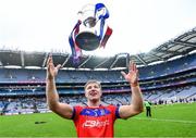 21 January 2024; Fintan Burke of St Thomas' celebrates with the Tommy Moore Cup after his side's victory in the AIB GAA Hurling All-Ireland Senior Club Championship Final match between O’Loughlin Gaels of Kilkenny and St Thomas’ of Galway at Croke Park in Dublin. Photo by Piaras Ó Mídheach/Sportsfile