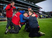 21 January 2024; St Thomas' manager Kenneth Burke, centre, celebrates with backroom team after his side's victory in the AIB GAA Hurling All-Ireland Senior Club Championship Final match between O’Loughlin Gaels of Kilkenny and St. Thomas’ of Galway at Croke Park in Dublin. Photo by Ramsey Cardy/Sportsfile