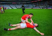 21 January 2024; Evan Duggan, bottom, and John Headd of St Thomas' after their side's victory in the AIB GAA Hurling All-Ireland Senior Club Championship Final match between O’Loughlin Gaels of Kilkenny and St. Thomas’ of Galway at Croke Park in Dublin. Photo by Ramsey Cardy/Sportsfile