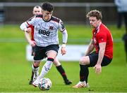 21 January 2024; Ryan O'Kane of Dundalk in action against Cormac Herlihy of Malahide United AFC during the PTSB Leinster Senior Cup Group A match between Malahide United and Dundalk at Gannon Park in Malahide, Dublin. Photo by Tyler Miller/Sportsfile
