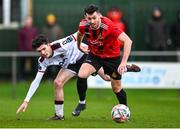 21 January 2024; Alan O'Shaughnessy of Malahide United AFC in action against Luke Mulligan of Dundalk during the PTSB Leinster Senior Cup Group A match between Malahide United and Dundalk at Gannon Park in Malahide, Dublin. Photo by Tyler Miller/Sportsfile