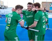 21 January 2024; John McKee, centre, Peter McKibbin, left, and Michael Robson of Ireland celebrate after the FIH Men's Olympic Hockey Qualifying Tournament third/fourth place play-off match between Ireland and Korea at Campo de Hockey Hierba Tarongers in Valencia, Spain. Photo by David Ramirez/Sportsfile